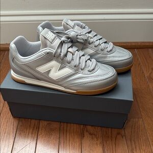 New Balance women’s Silver and White Sneakers